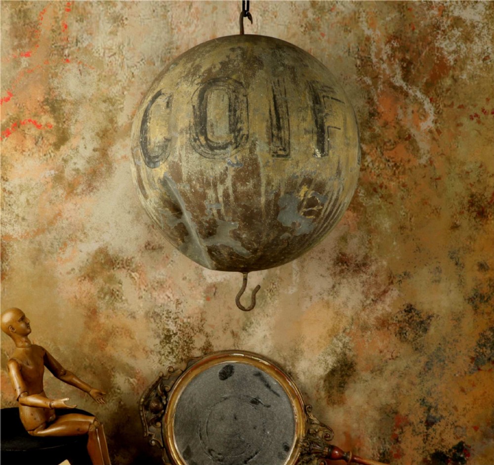 A 19th-century spherical zinc French coiffeur trade sign featuring hand-painted lettering and iron hanging hooks. View XII