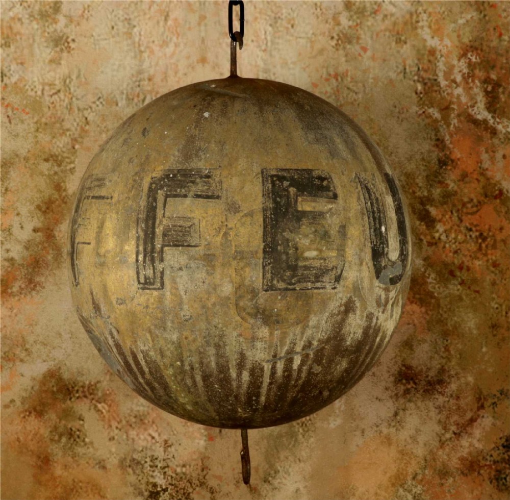 A 19th-century spherical zinc French coiffeur trade sign featuring hand-painted lettering and iron hanging hooks. View XV