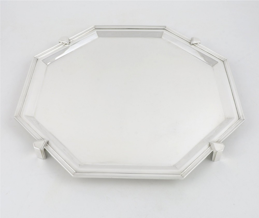 An octagonal silver-plated Art Deco cocktail tray featuring geometric corner accents and a polished smooth surface.