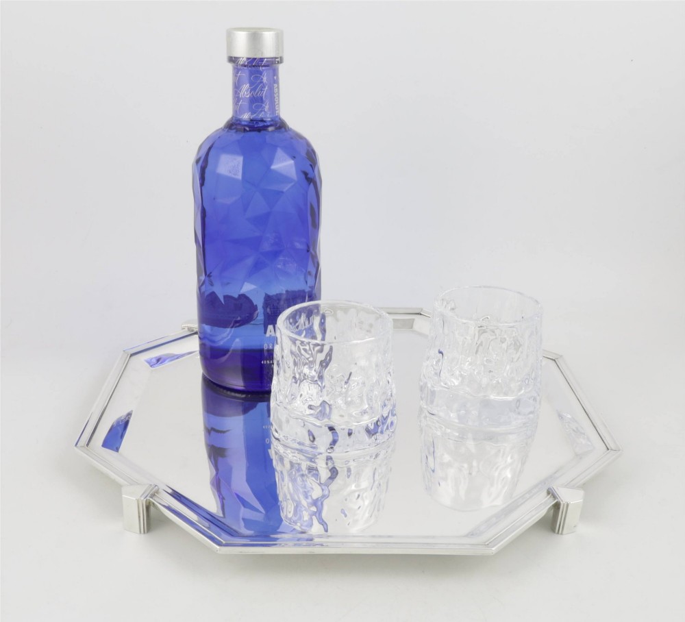 An octagonal silver-plated Art Deco cocktail tray featuring geometric corner accents and a polished smooth surface. View X