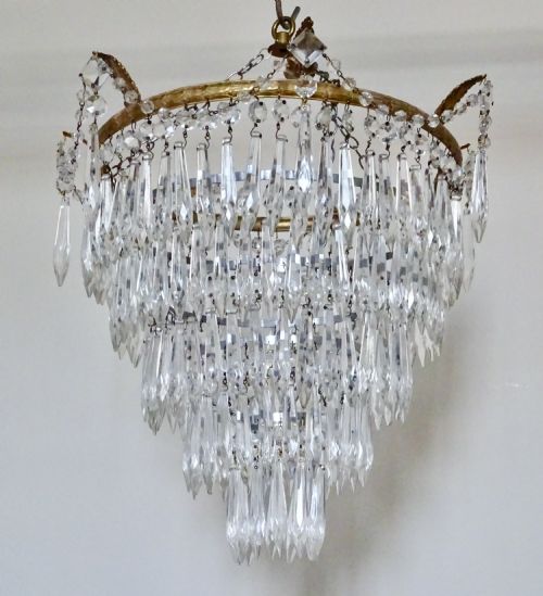 A Five Tier Glass Drop Chandelier