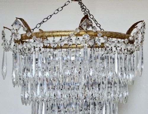 fig 1. A FIVE TIER GLASS DROP CHANDELIER