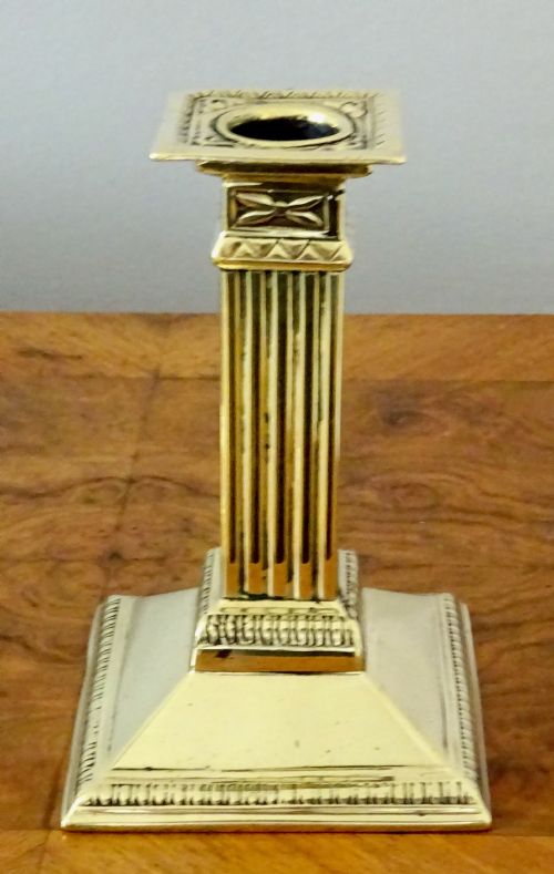 fig 1. A PAIR OF BRASS COLUMN CANDLESTICKS