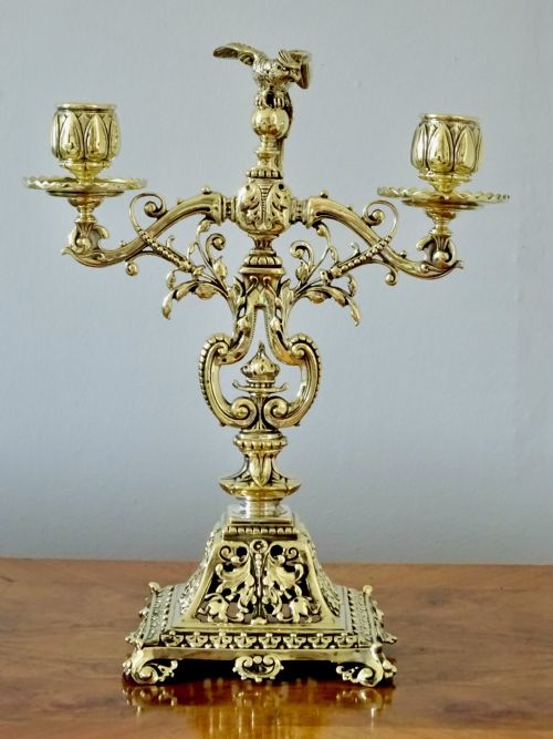 fig 1. 1887 - A BRASS CANDELABRA WITH A PARROT ON THE TOP