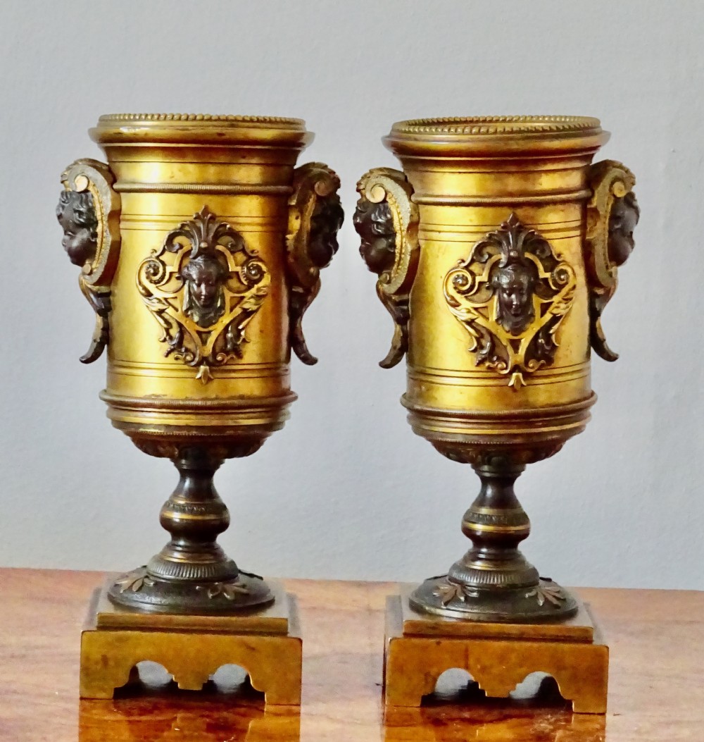 A PAIR OF VICTORIAN BRONZE CHERUB VASES View VIII