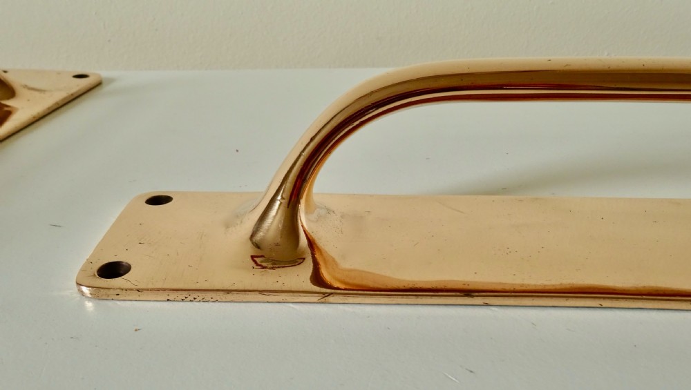 A PAIR OF LARGE BRONZE DOOR HANDLES View III