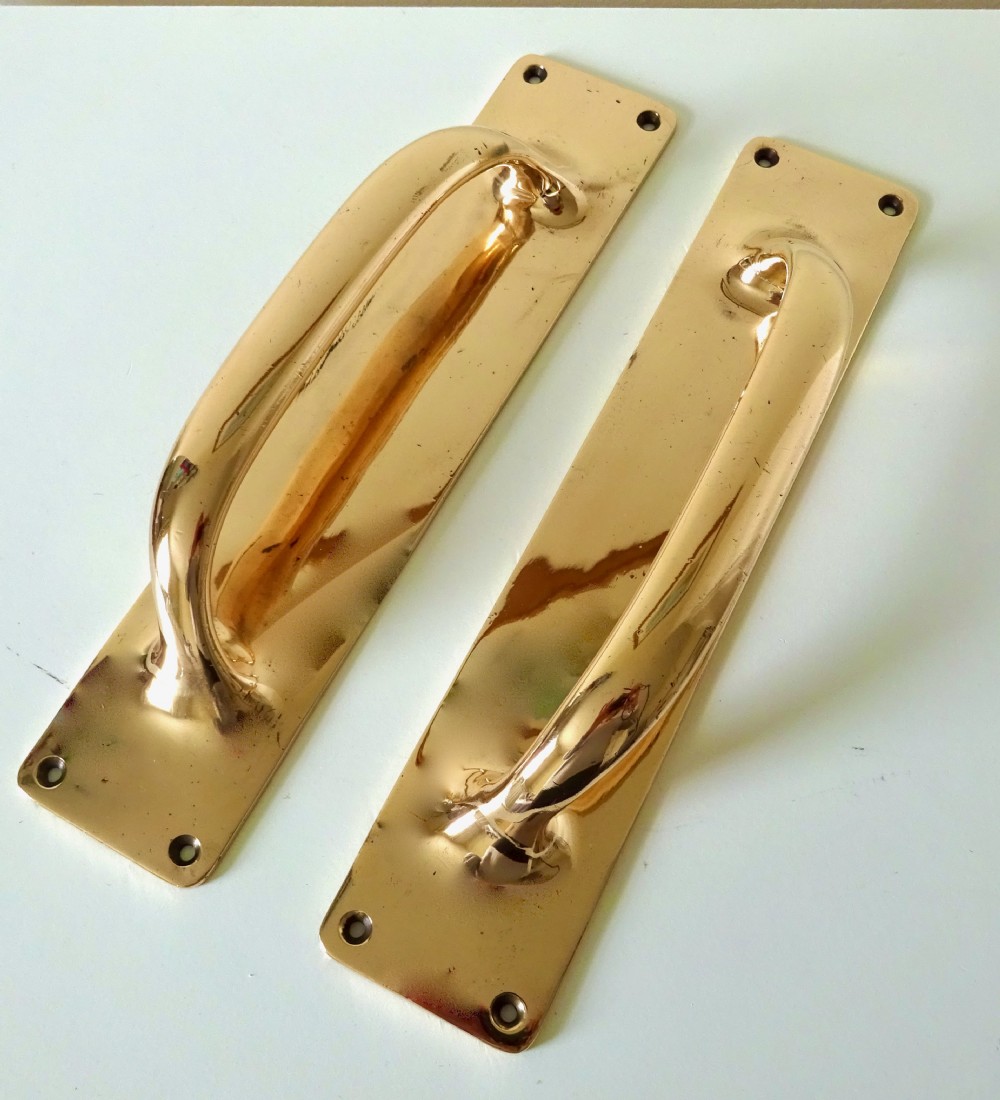 A PAIR OF LARGE BRONZE DOOR HANDLES View V