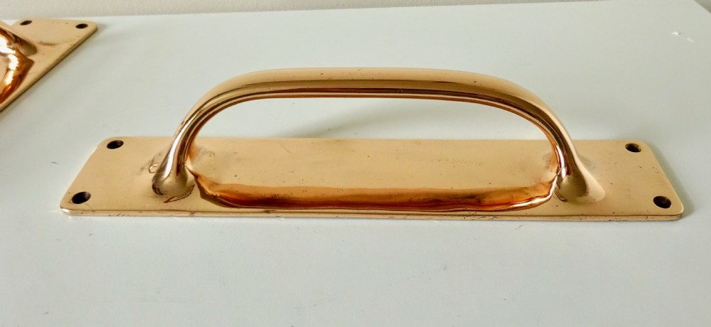 A PAIR OF LARGE BRONZE DOOR HANDLES View II
