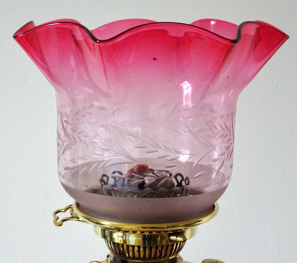 A BENSON OIL LAMP WITH ORIGINAL CRANBERRY SHADE View V