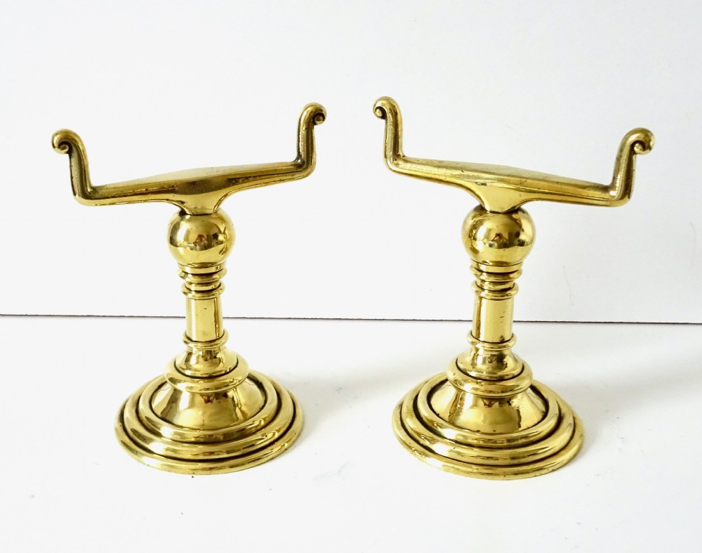 A PAIR OF HEAVY, SOLID BRASS FIRE DOGS