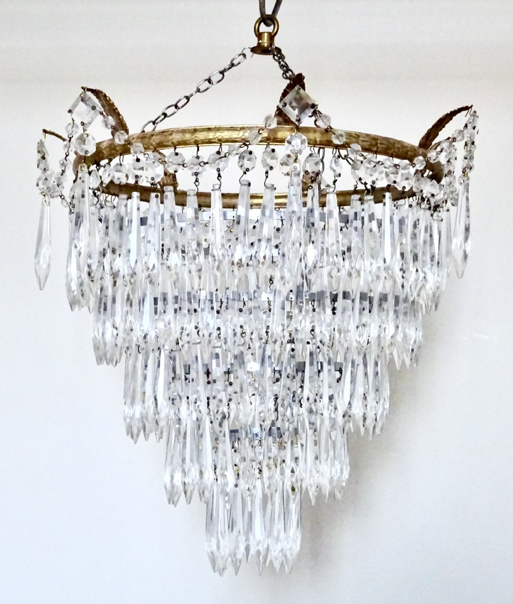 A FIVE TIER GLASS DROP CHANDELIER View V