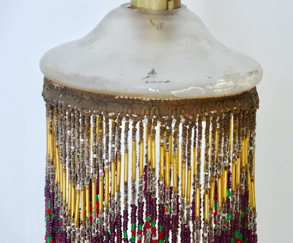 AN ORIGINAL BEADED LAMPSHADE WITH ORIGINAL OPAQUE GLASS TOP View IV