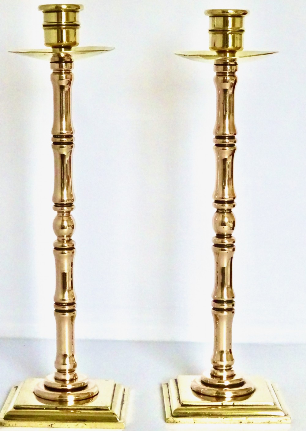 PAIR VICTORIAN BRONZE AND BRASS CANDLESTICKS