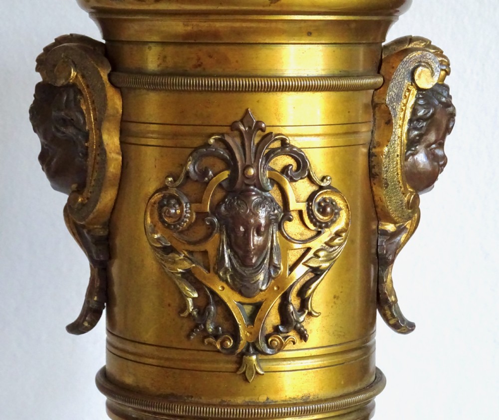 A PAIR OF VICTORIAN BRONZE CHERUB VASES View III