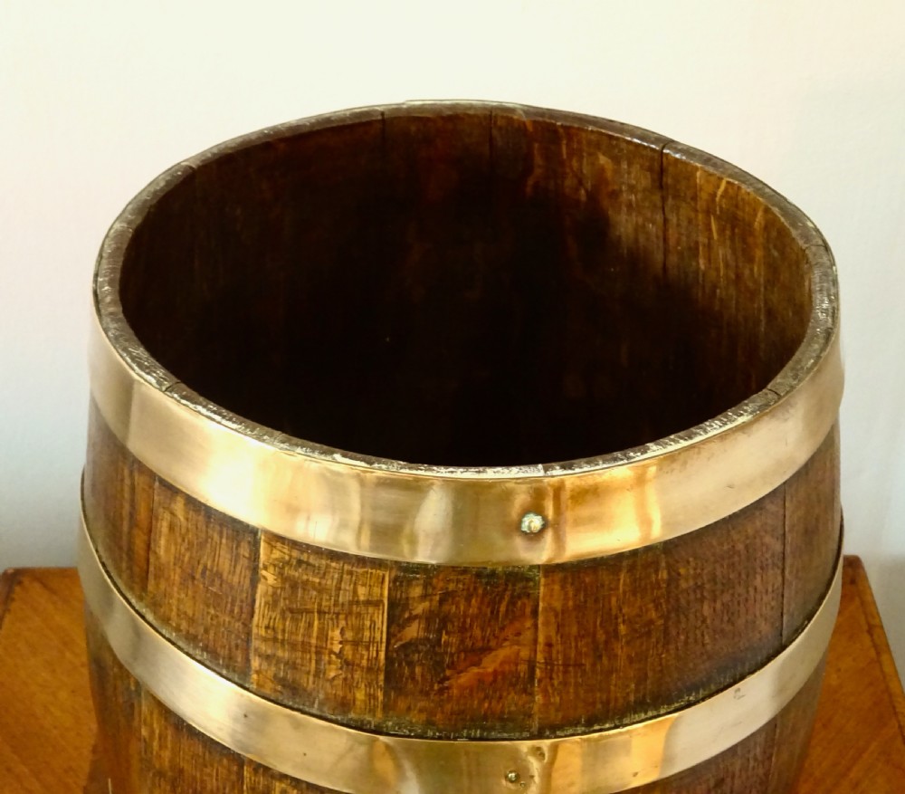 AN OAK COOPERED BARREL WITH BRONZE BANDING View II