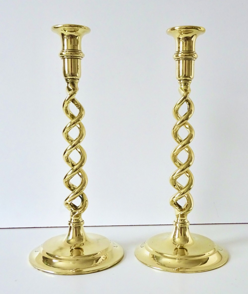 A PAIR OF  BRASS  BARLEY TWIST CANDLESTICKS