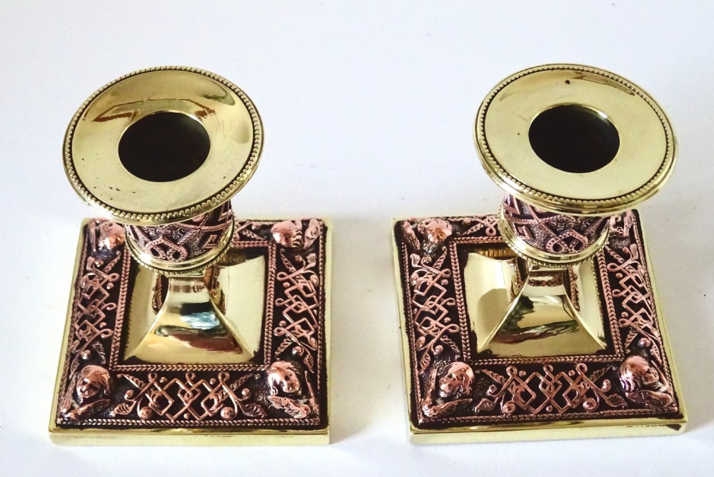 PAIR OF BRASS AND COPPER FILIGREE CANDLESTICKS