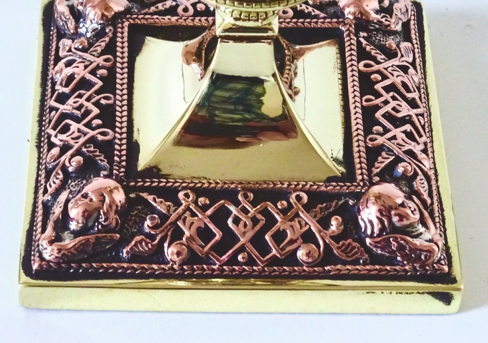 PAIR OF BRASS AND COPPER FILIGREE CANDLESTICKS View V