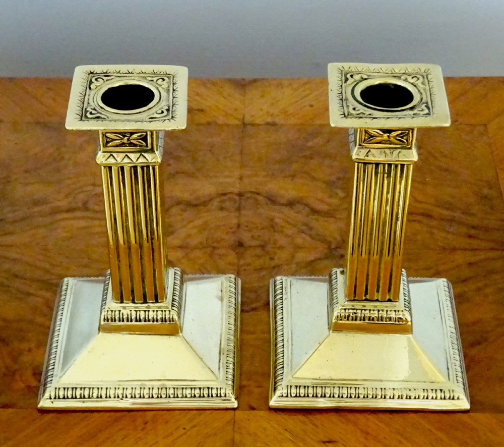 A PAIR OF  BRASS COLUMN CANDLESTICKS View IV