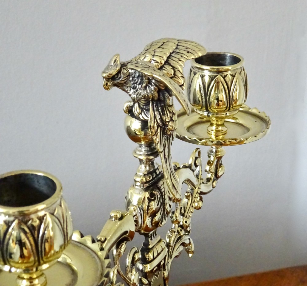 1887 - A BRASS CANDELABRA WITH A PARROT ON THE TOP View IV