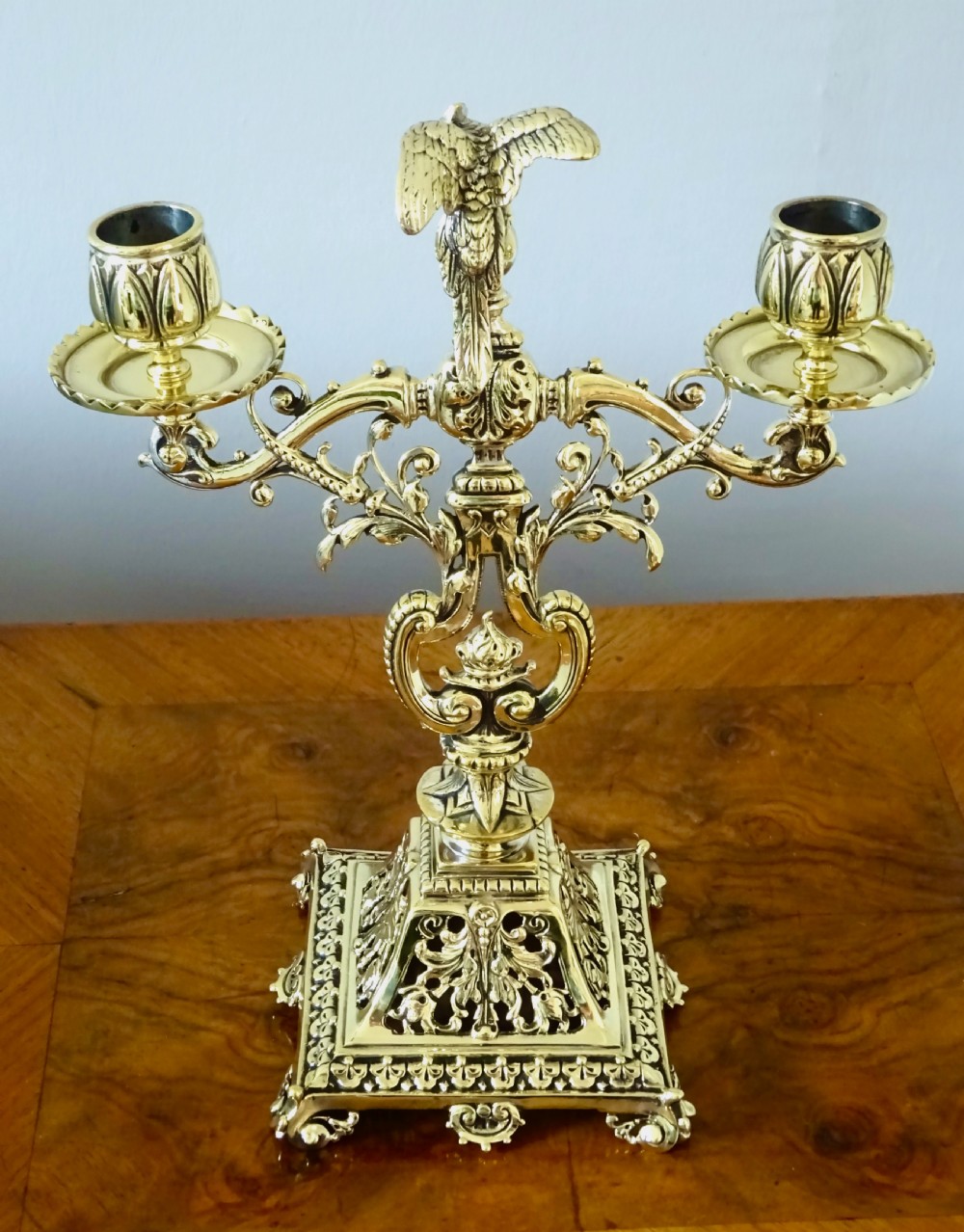 1887 - A BRASS CANDELABRA WITH A PARROT ON THE TOP View V