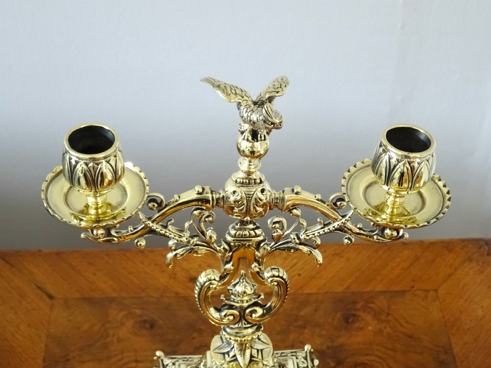 1887 - A BRASS CANDELABRA WITH A PARROT ON THE TOP View IX