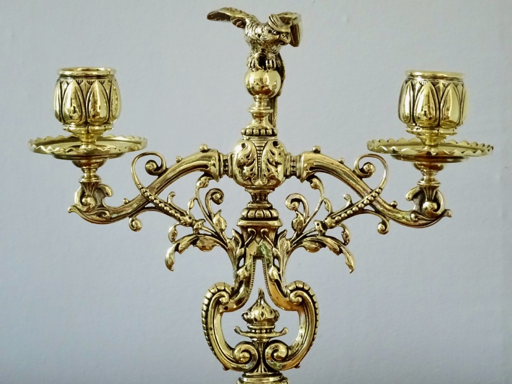 1887 - A BRASS CANDELABRA WITH A PARROT ON THE TOP View VI