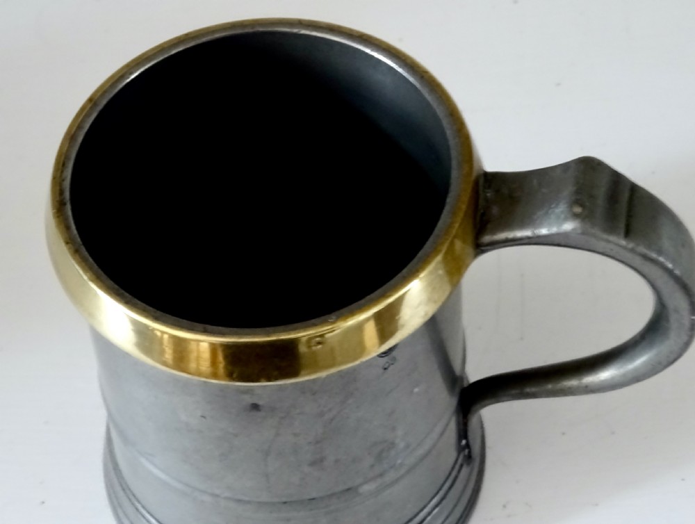 TWO LOFTUS PEWTER TANKARDS WITH BRASS RIMS View VII