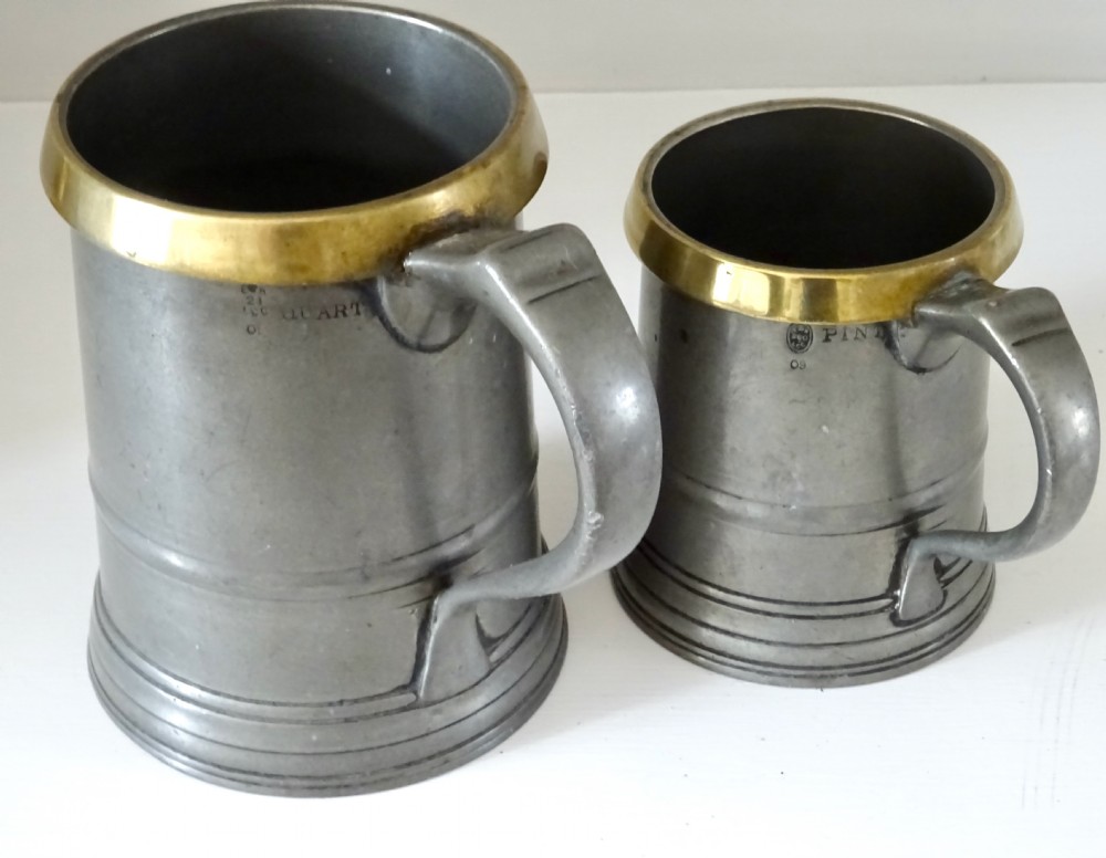 TWO LOFTUS PEWTER TANKARDS WITH BRASS RIMS View II