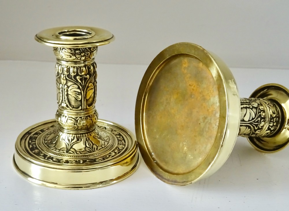 A PAIR OF SMALL DECORATIVE BRASS CANDLESTICKS View III