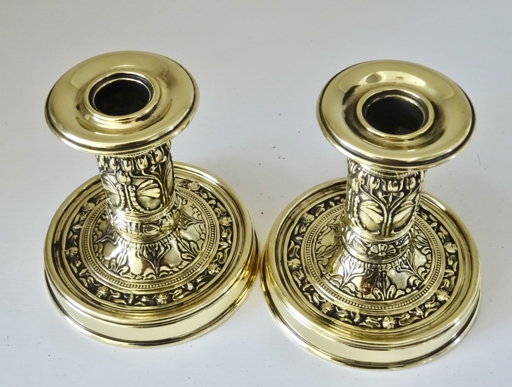 A PAIR OF SMALL DECORATIVE BRASS CANDLESTICKS View IV