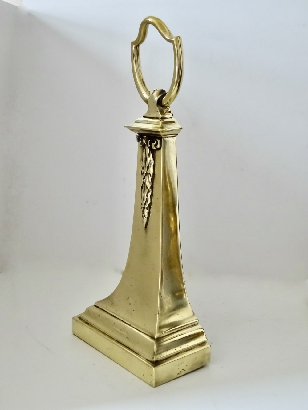 CIRCA 1884- A  HEAVY BRASS DOORSTOP