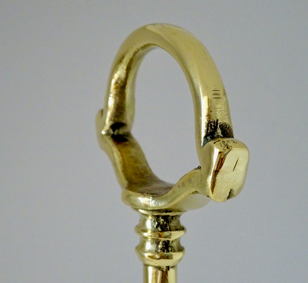 A TALL BRASS DOORSTOP View II