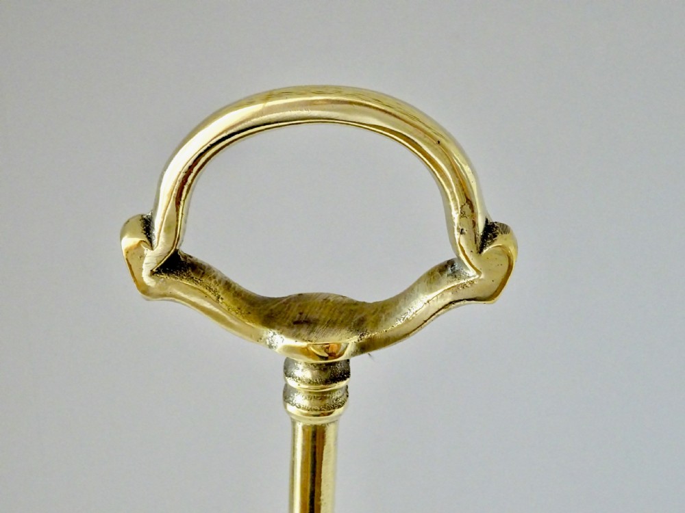A TALL BRASS DOORSTOP View III
