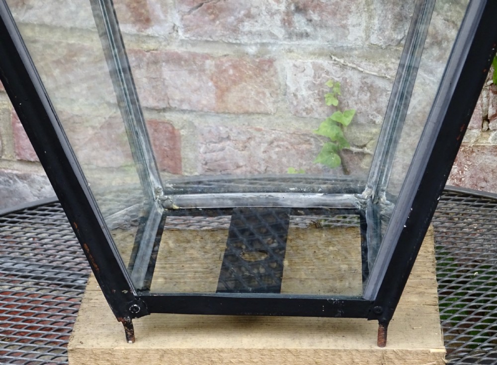 A late Victorian copper street lantern featuring a tiered cap with a finial, clear glass panels tapering downwards, and a black patinated frame. View III