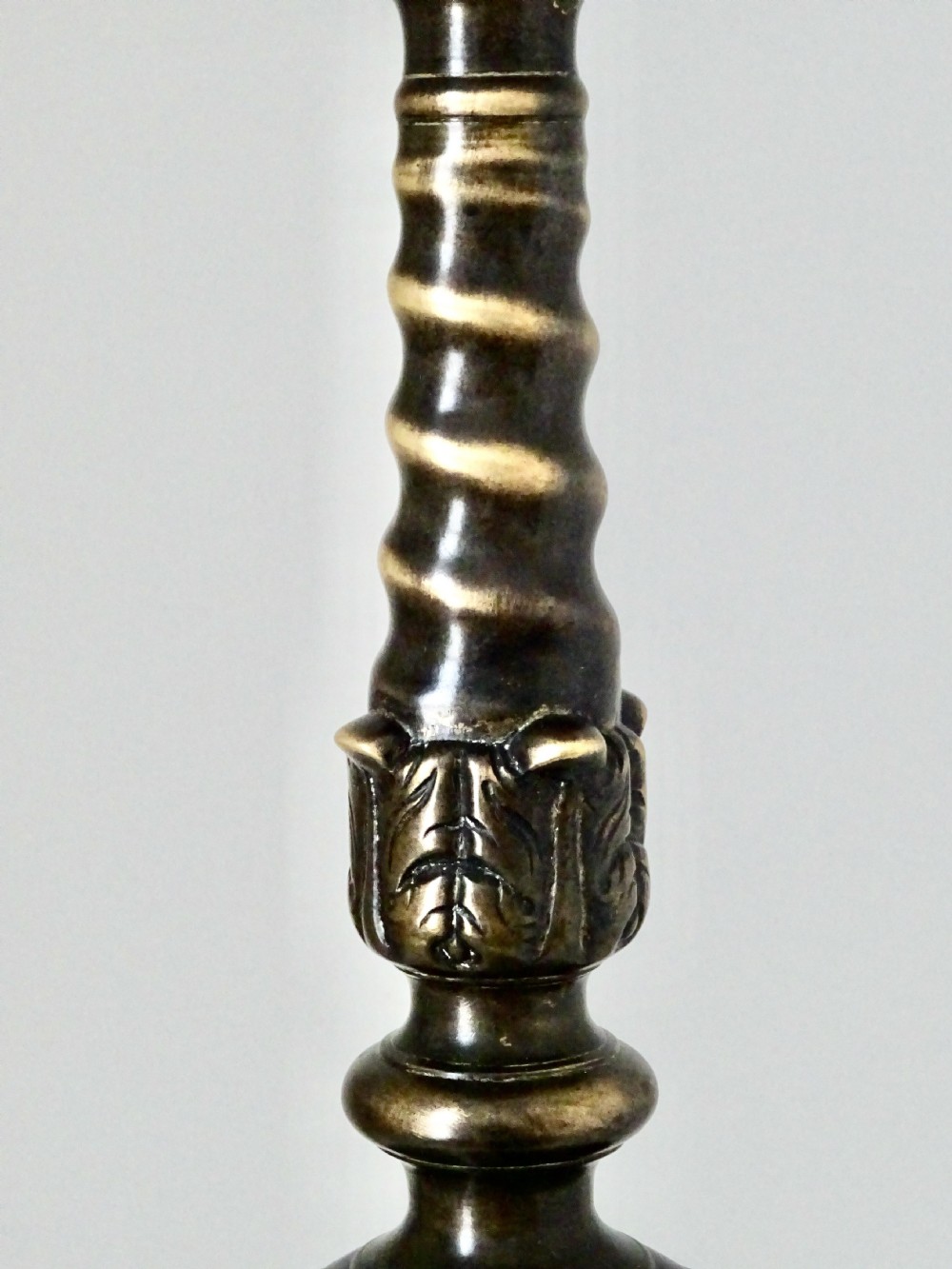 A tall, cast bronze candlestick featuring a turned spiral stem, wide sconce, and ornate claw-footed tripod base. View III