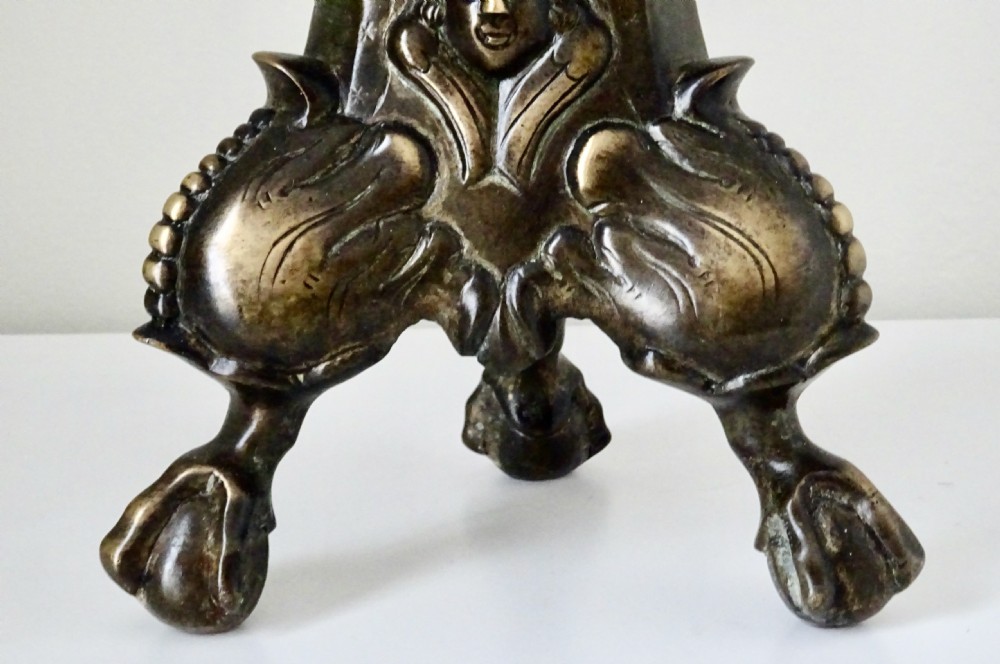 A tall, cast bronze candlestick featuring a turned spiral stem, wide sconce, and ornate claw-footed tripod base. View IV