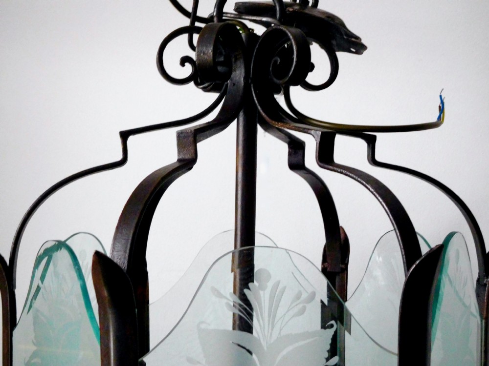 A late 19th-century hanging wrought iron hall lantern featuring etched glass panels with botanical motifs and gilt leaf accents. View II
