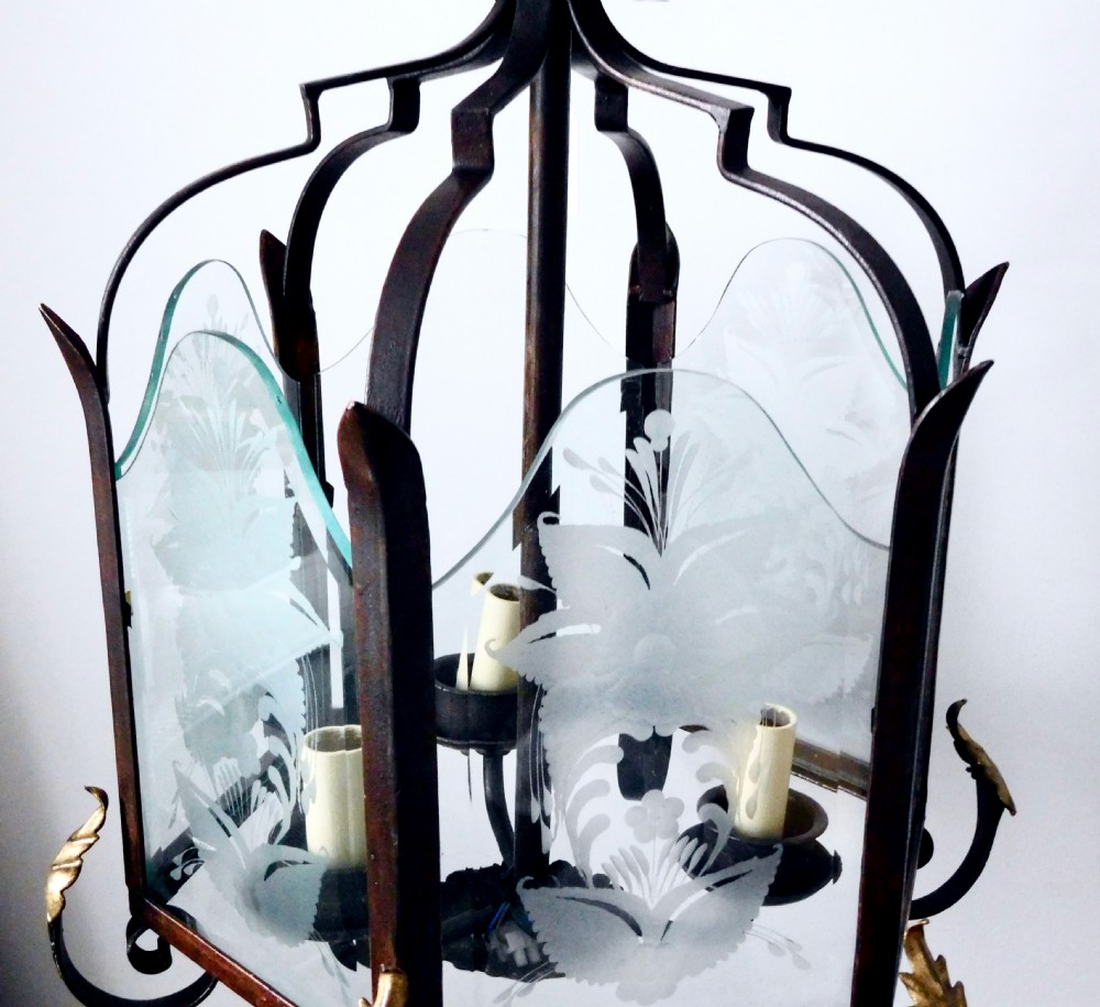 A late 19th-century hanging wrought iron hall lantern featuring etched glass panels with botanical motifs and gilt leaf accents. View III