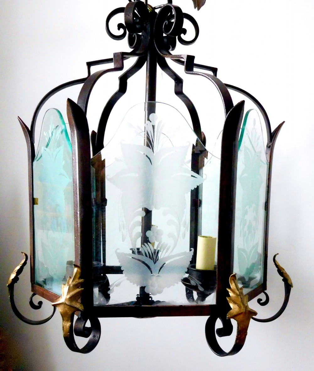 A late 19th-century hanging wrought iron hall lantern featuring etched glass panels with botanical motifs and gilt leaf accents. View VI