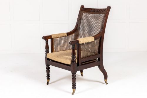 REGENCY MAHOGANY BERGRE LIBRARY ARMCHAIR IN THE MANNER OF GILLOWS