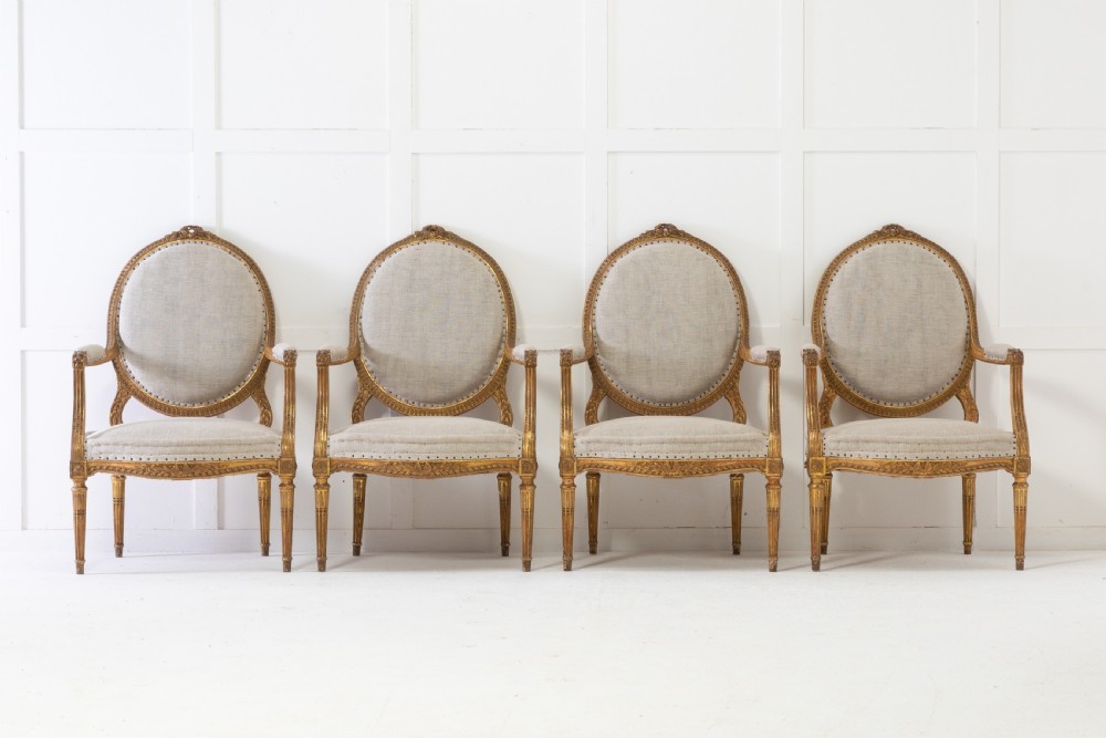 Set of Four 1920s French Gilt Carved Wood Armchairs