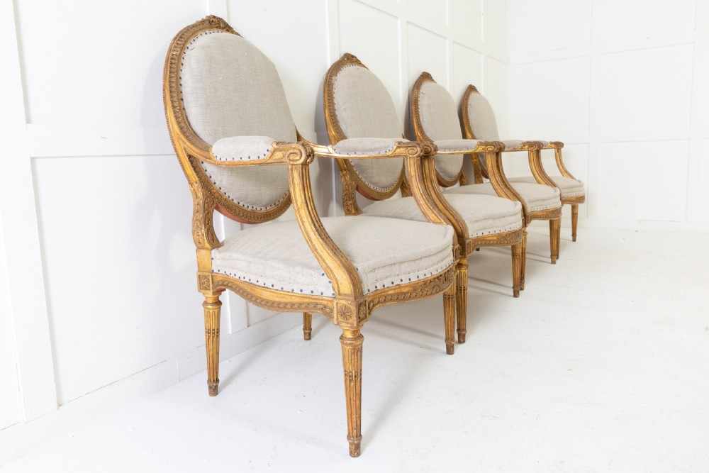 Set of Four 1920s French Gilt Carved Wood Armchairs View III
