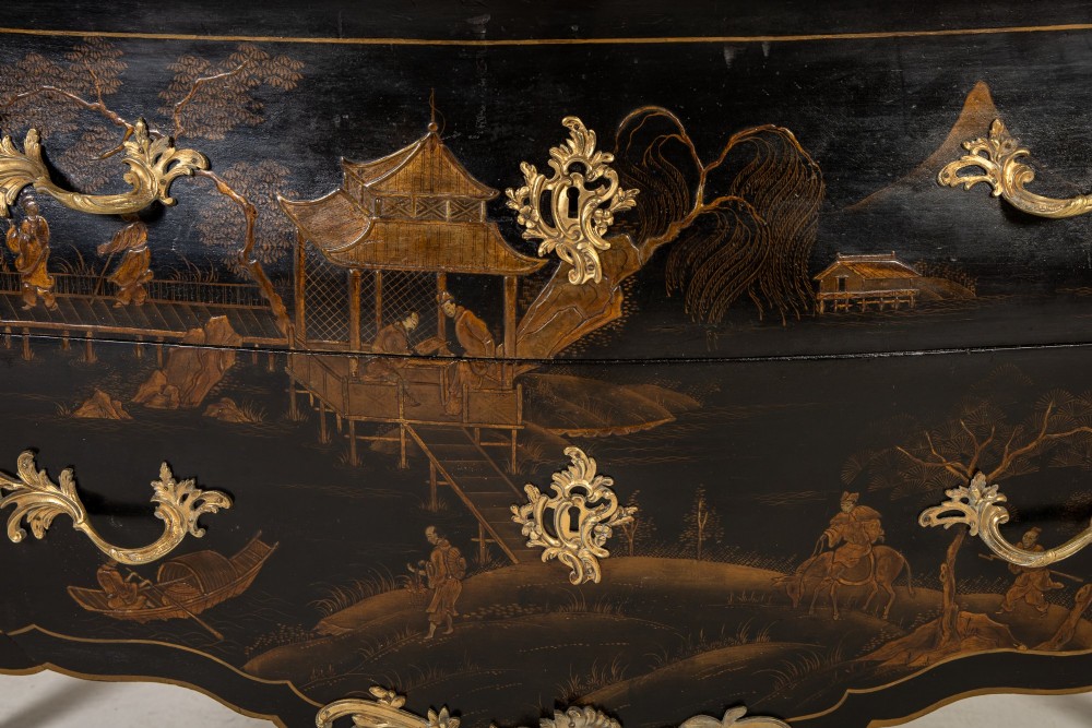 A French Louis XV style bombe commode featuring black japanned lacquer with detailed gold Chinoiserie landscapes, a shaped marble top, and gilt bronze mounts. View III