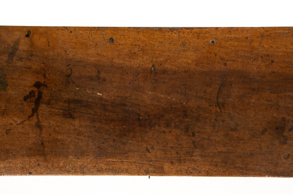 A 17th-century Spanish walnut side table featuring three carved drawer fronts, turned legs, and a low stretcher base. View IX