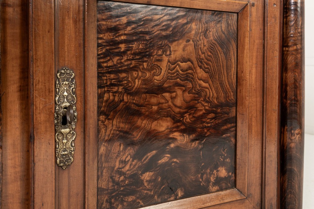 An 18th-century French cherrywood enfilade sideboard featuring three top drawers, three panelled doors with burr ash veneers, and decorative brass hardware. View X