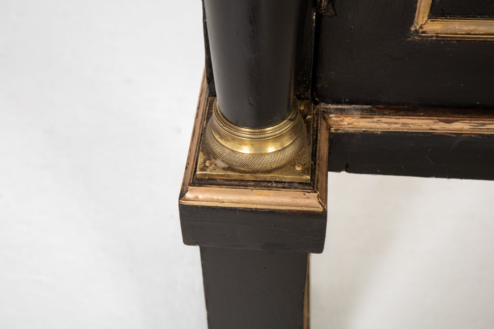 A pair of matching 18th-century Italian ebonised side cabinets featuring gilt metal mounts, fluted corner columns, single top drawers, and double panelled doors. View VII