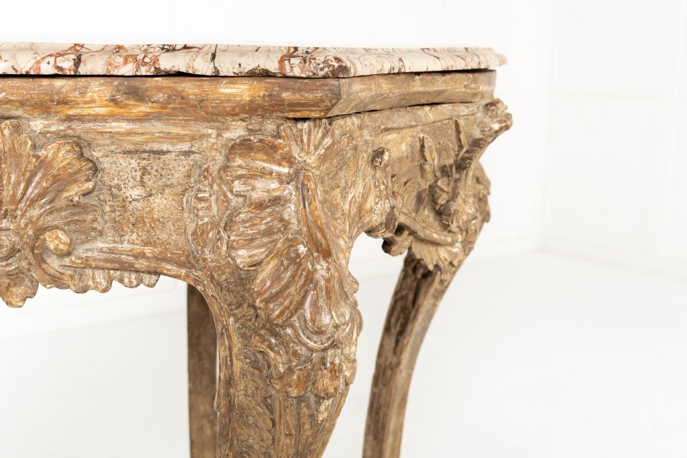 An 18th-century Italian Rococo silver-gilt console table featuring carved leaf motifs, cabriole legs, and a rectangular pink marble top. View XII