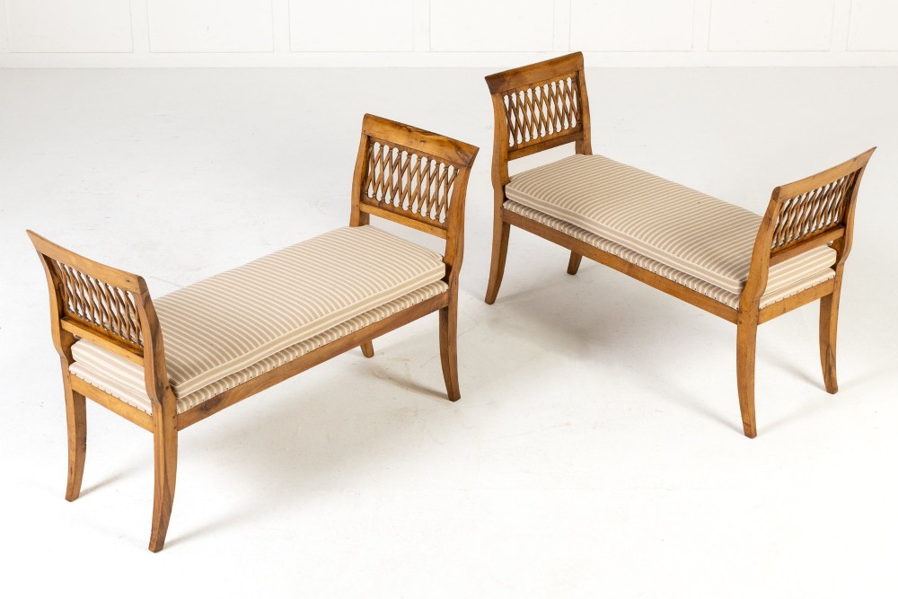 A pair of 19th-century French walnut window seats with carved lattice ends and striped upholstered cushions. View III