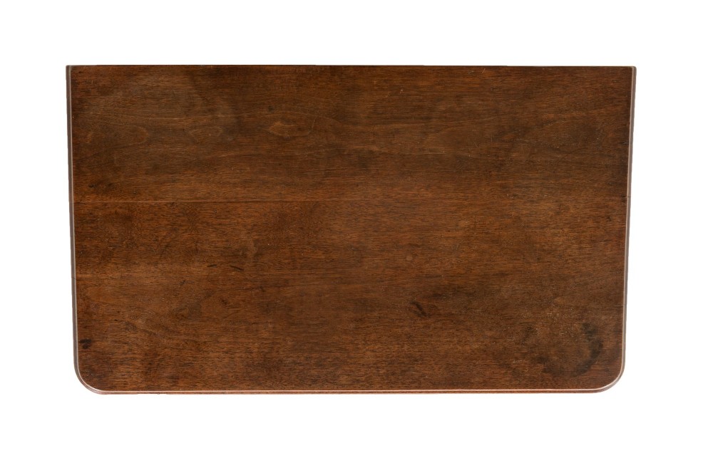 An 18th-century English walnut chest of drawers featuring two short drawers over three long drawers with brass hardware and bracket feet. View VI